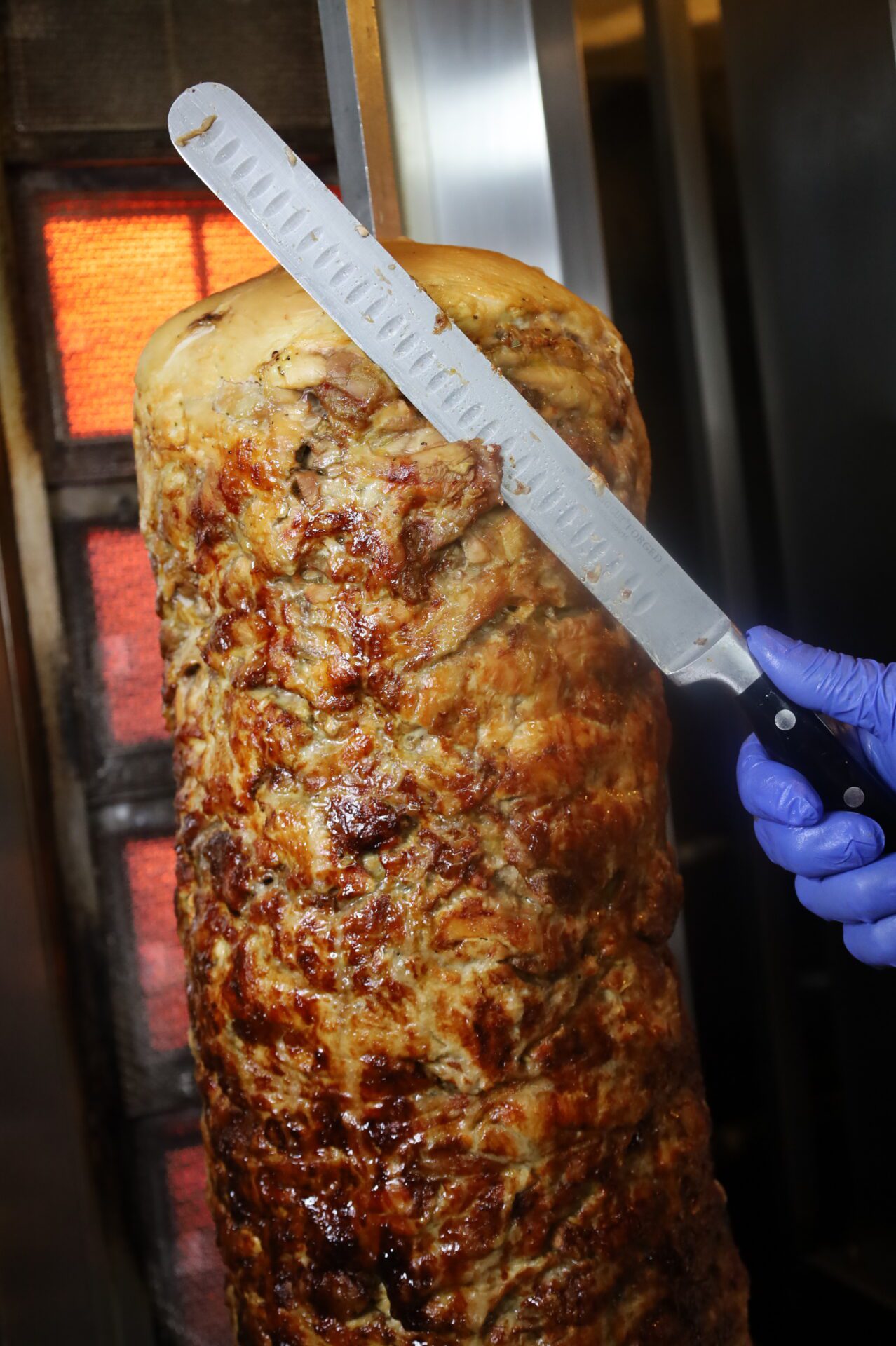 chef cutting Chicken shawarma